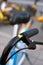 Close-up of the handlebars of a shared bike