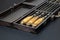 Close up handles Big luxury stainless steel skewers set in wooden box for grill and barbecue. Expensive high quality