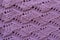 Close up of handmade knitted mauve openwork