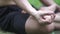 Close up hands. Asian man do yoga relax outdoor. Man exercising pose vital and meditation for fitness lifestyle club at the