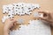 Close up of hands business women connecting jigsaw puzzleon, Tea