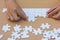 Close up of hands business women connecting jigsaw puzzleon, Tea