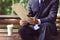 Close up of the hands of the businessman with a newspaper