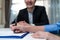 Close up hands of businesswoman sign contract agreement on paper with pen after negotiation for Business deal and acquisition. Inv