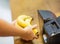 Close up of hands buying bananas at checkout