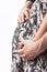 Close-up of Hands of Caucasian Couple Standing Together With Hands on Abdomen of Pregnant Female