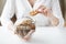 Close up of hands with chocolate cookies in jar