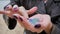 Close-up of hands covered with bright sparkles. Woman shows shiny hands, fingering with fingers