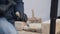 Close up of hands of craftsman carve with a gouge in the hands on the workbench in carpentry