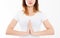 Close-up of hands of cute girl in white tshirt , meditating indoors, focus on arms in Namaste gesture. Asian medicine, yoga