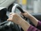 Close up of Hands Driving Car Concept