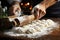 Close-up of hands dusting a Christmas stollen - stock photography concepts