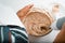 Close-up of hands of elderly woman cook preparing cream pie filling, housewife whipping ingredients with blender mixer