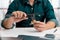 Close up hands of an engineer measures a metal part with Vernier caliper