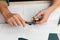 Close up hands of an engineer measures a metal part with Vernier caliper