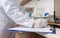 Close-up of the hands of an expert analyzing sample in the laboratory