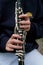 Close up of hands and fingers working as a clarinet is played