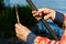 Close-up of the hands of the fisherman. Fisherman holding a fishing pole, bobber and hook