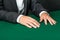 Close up of hands of gambler sitting at the table