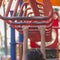 close up hands of girl playing on playground, hanging walk along