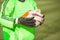 Close up of the hands of the goalkeeper holding a soccerball.