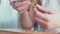 Close-up of the hands of a goldsmith. Needlework. Jewellery and handmade jewelry.