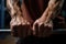 close-up of hands gripping a barbell in a gym setting