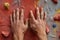 close-up of hands gripping a climbing wall