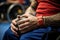 a close-up of hands gripping the wheels during a wheelchair rugby game