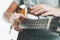 Close-up on the hands of a guitarist playing classical guitar in an unusual technique