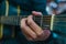 Close-up of the hands of a guitarist pressing the strings