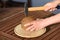 Close up on hands hammering a coconut