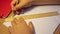 Close-up hands of a high school student build a geometric figure along a ruler