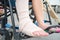 Close up of hands holding crutches waking on the street