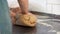 Close-up of hands kneading dough with chickpeas. Home cooking recipe