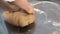 Close-up of hands kneading dough with chickpeas. Home cooking recipe