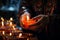 Close-up of hands lighting candles and incense in an Orthodox home, marking the New Year with traditional customs and prayers,