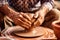 Close-up of hands making clay pots