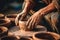 Close-up of hands making clay pots