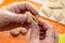 Close-up of hands making dumplings