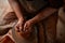 Close-up hands of a male potter in apron squizing wrong bowl from clay, selective focus