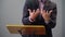 Close up hands of a male public speaker while giving a speech and explaining something. Shallow depth of field