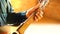 Close up of hands of a man playing a guitar in Ludhiana, Punjab, India