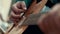Close up hands man playing music on strings acoustic guitar