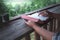 Close up hands of man reading and learning a holy bible in morning on wooden table. christian concept