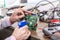 Close up of the hands men hold tool repairs electronics manufacturing Services, Manual Assembly Of Circuit Board Soldering