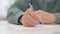 Close up of Hands of Middle Aged Man Writing on Paper