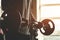 Close-up of the hands of a muscular man performs exercises with a barbell in the gym. Endurance Strength Training