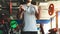 Close-up of the hands of a muscular man performs exercises with a barbell in the gym. Endurance Strength Training