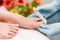 Close-up of the hands of a nail technician wearing surgical gloves